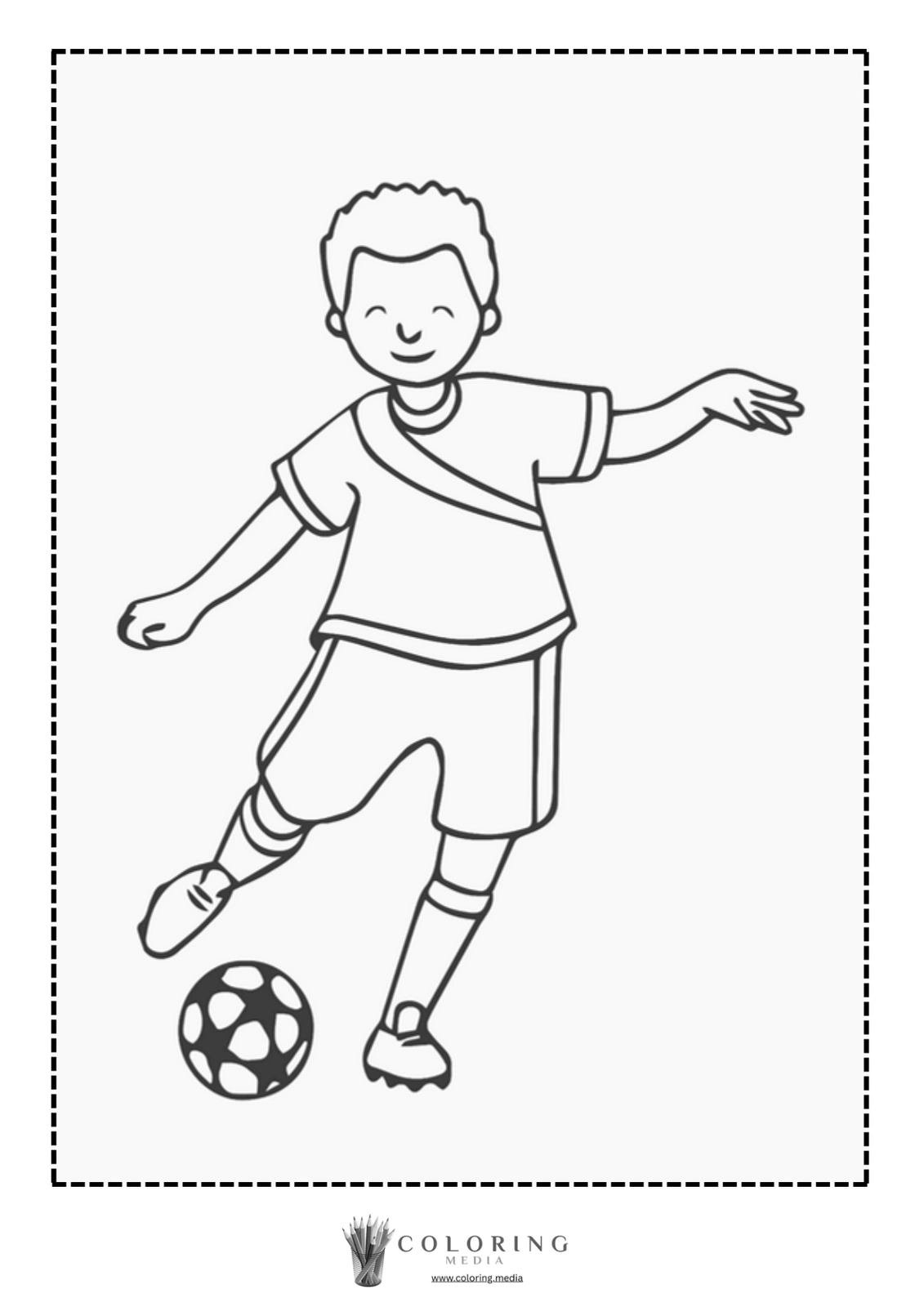 A smiling boy kicks a soccer ball while standing on one leg.