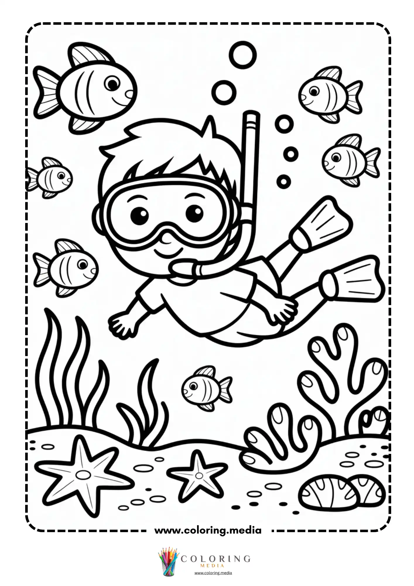Boy snorkeling among colorful fish